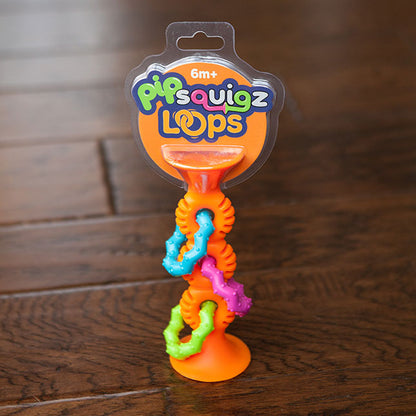Pip Squigz Loop™ Naranjo, mordedor y sonajero sensorial 6m+